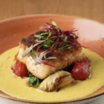 SEARED HALIBUT ~ GF on request, Artichoke hearts, tomato confit, sauteed spinach, roasted corn-butter sauce